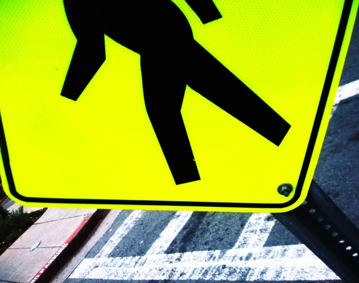 a pedestrian crosswalk sign is shown in this po