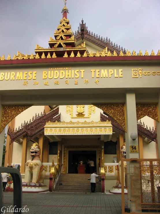 a chinese buddhist temple with two people on either side