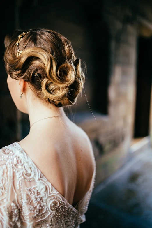 a woman that is standing with her back to the camera