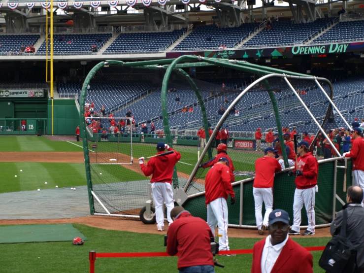 some baseball players are on the field for practice