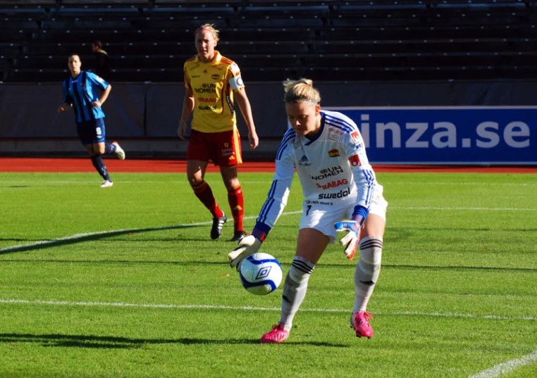 the two teams are playing soccer in the field