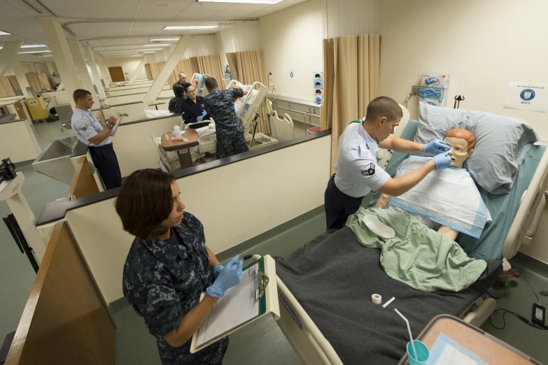 several medical workers at work in the hospital room