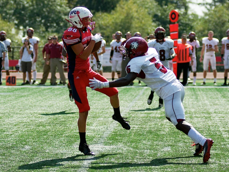 a group of men on a field playing football