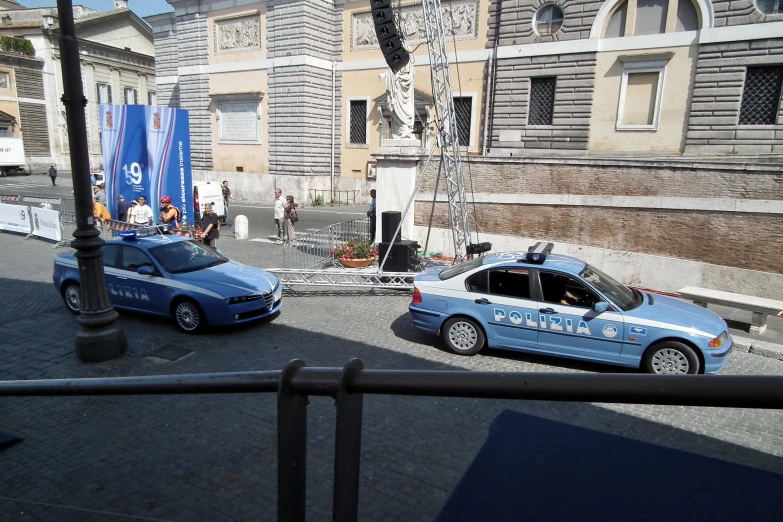 an image of a blue police car on the street