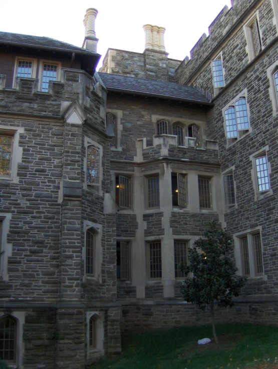 a large, old stone castle building with three windows