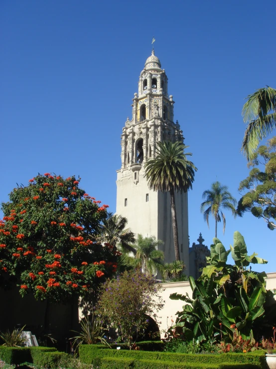 a tall white building sitting near a park