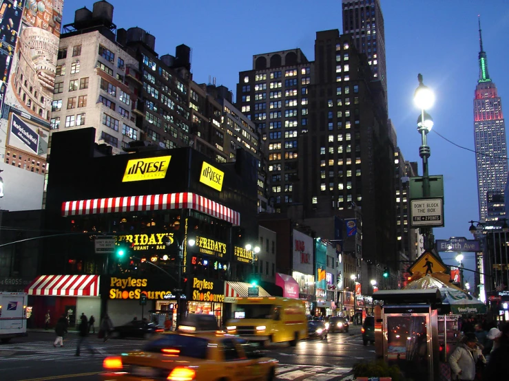 taxis driving down the street in new york city