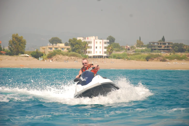 a man on a jet ski riding in the water