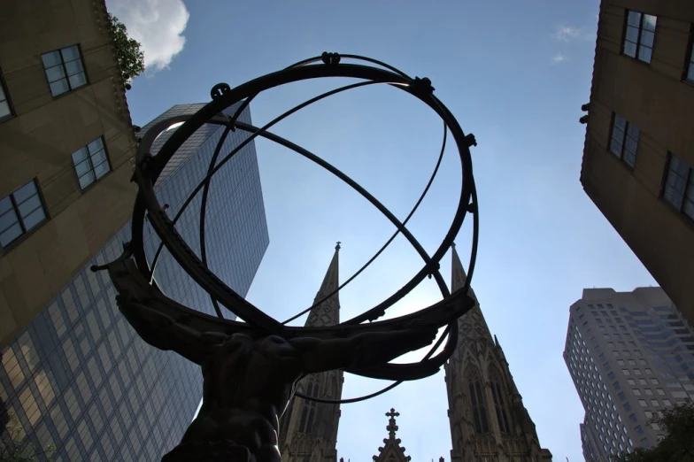 a giant metal piece with an elaborate looking statue