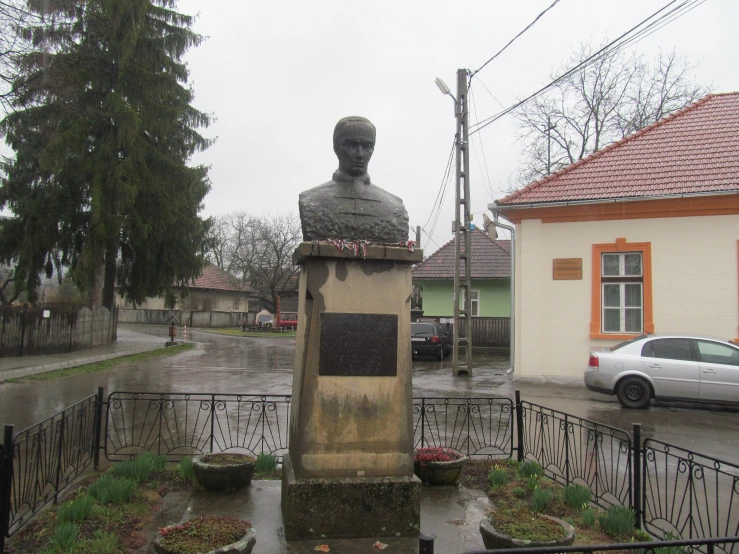 a busturine in front of a building in the rain