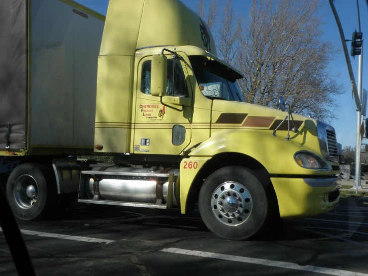 this truck is yellow and has red lettering on it