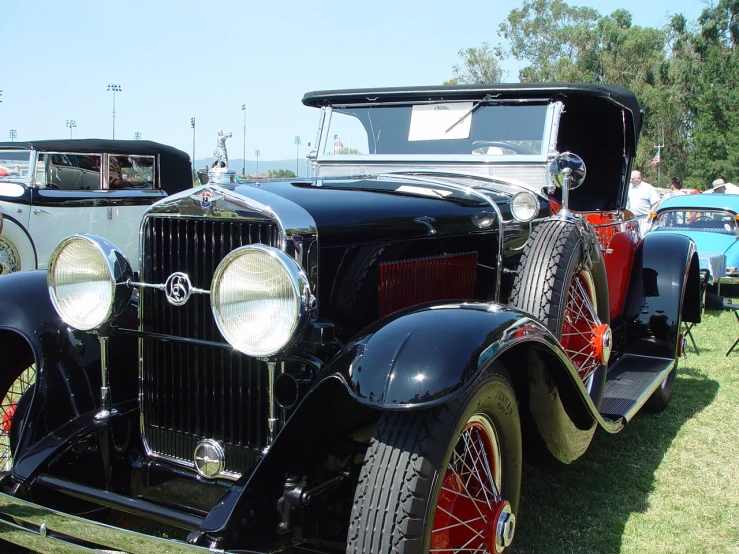 there is a black car on display at this event