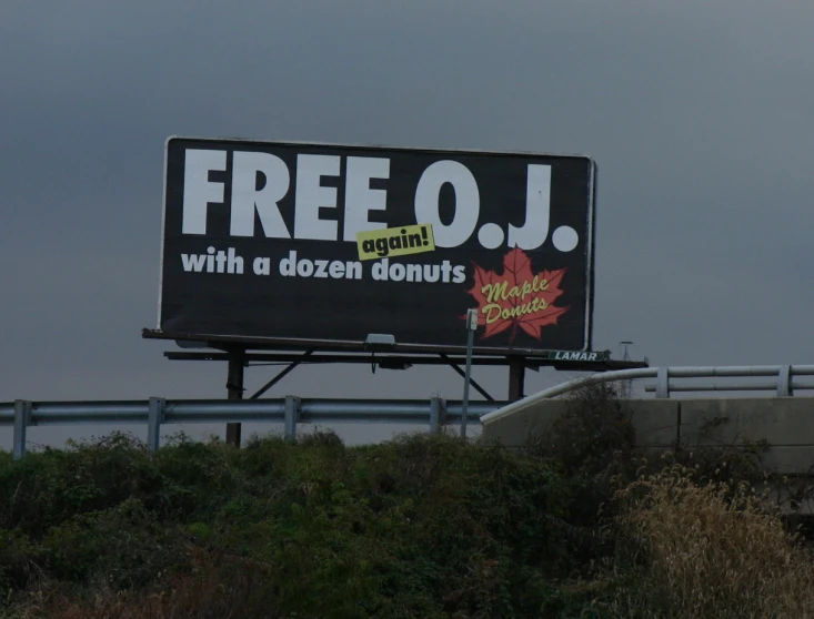 a billboard that has been advertising a discounted doughnut