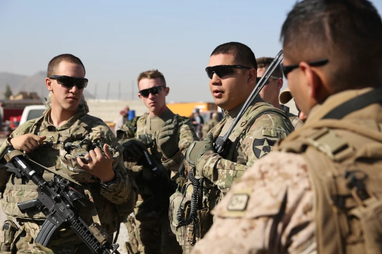 several men in military uniforms talking together