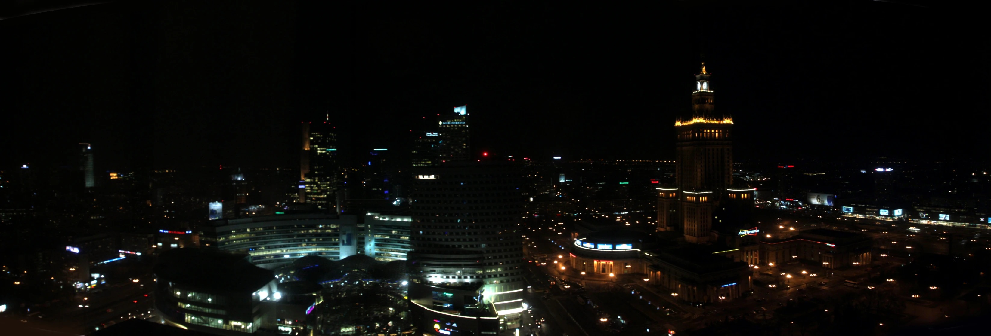 a night scene of large city lights and buildings