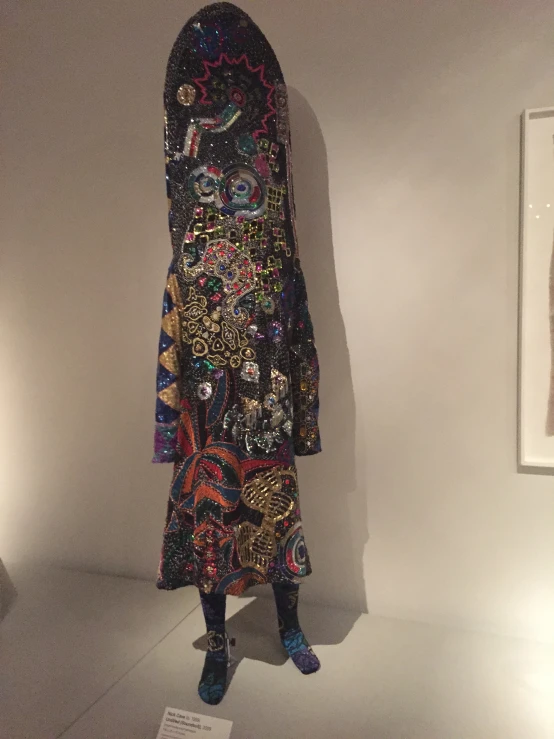 a large colorful dress with a headdress on