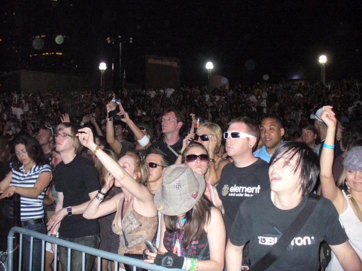a large crowd is gathered at a concert