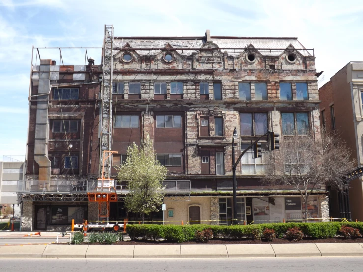 old dilapidated, brick building in a small city area