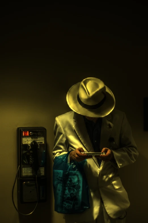 a man dressed up in a white suit and hat