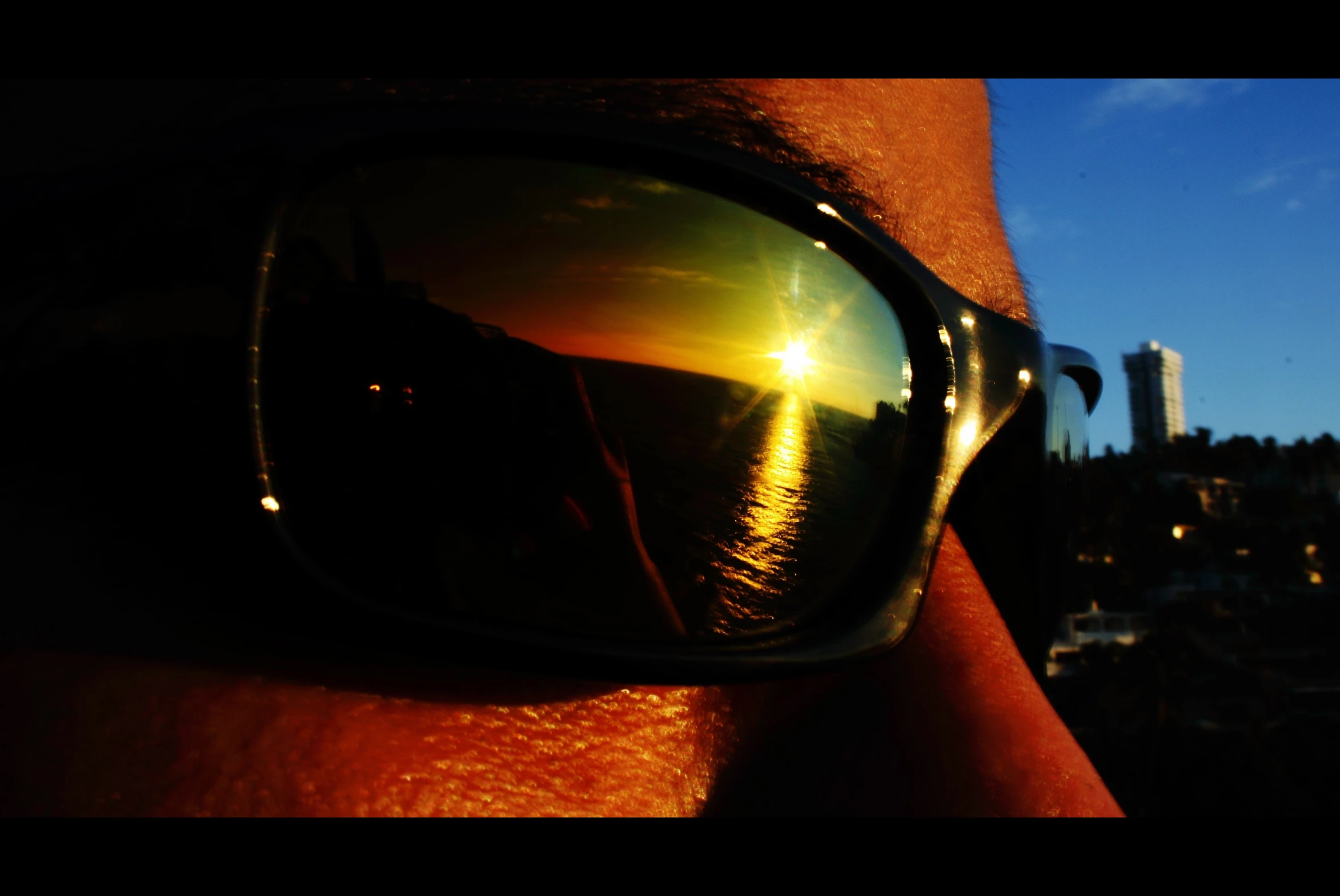 close up view of the reflection of some sunglasses