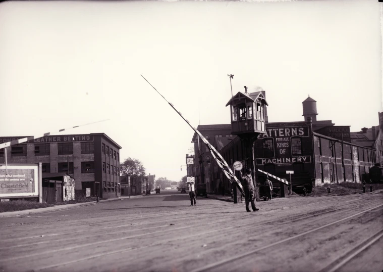 old po of two men with fishing rods in the middle of street