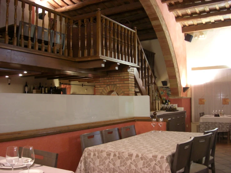 an empty dining room in a restaurant with stairs