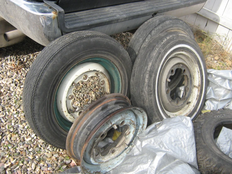 old tires, rims and wheels are left abandoned