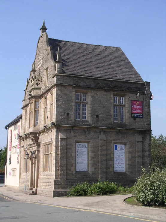 an old building on the side of the road