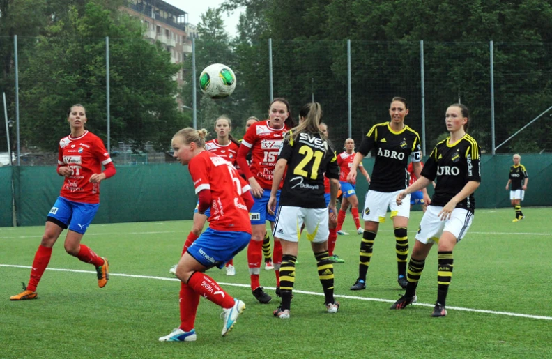 s playing a soccer game in front of a group of spectators