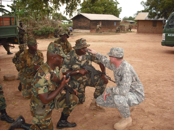 an army soldier pointing soing to another soldiers