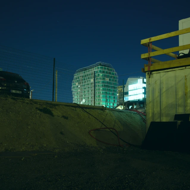 a tall building sitting on top of a hill