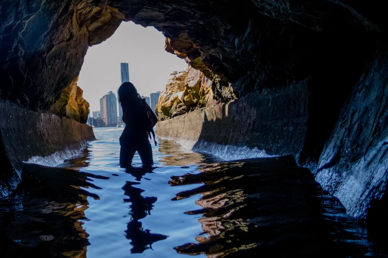 a person stands in a body of water