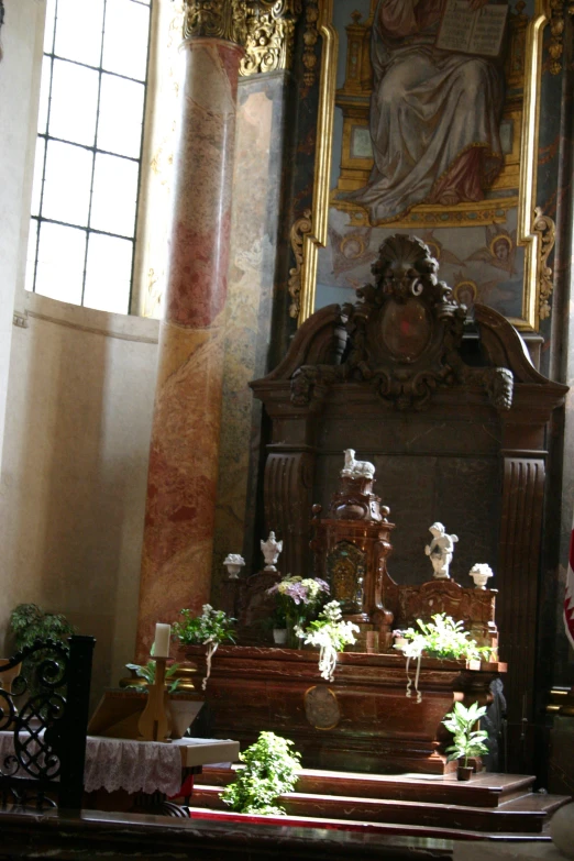 the altar in a church is surrounded by flowers