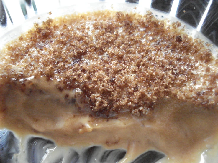 closeup of a dessert in a glass bowl with sauce