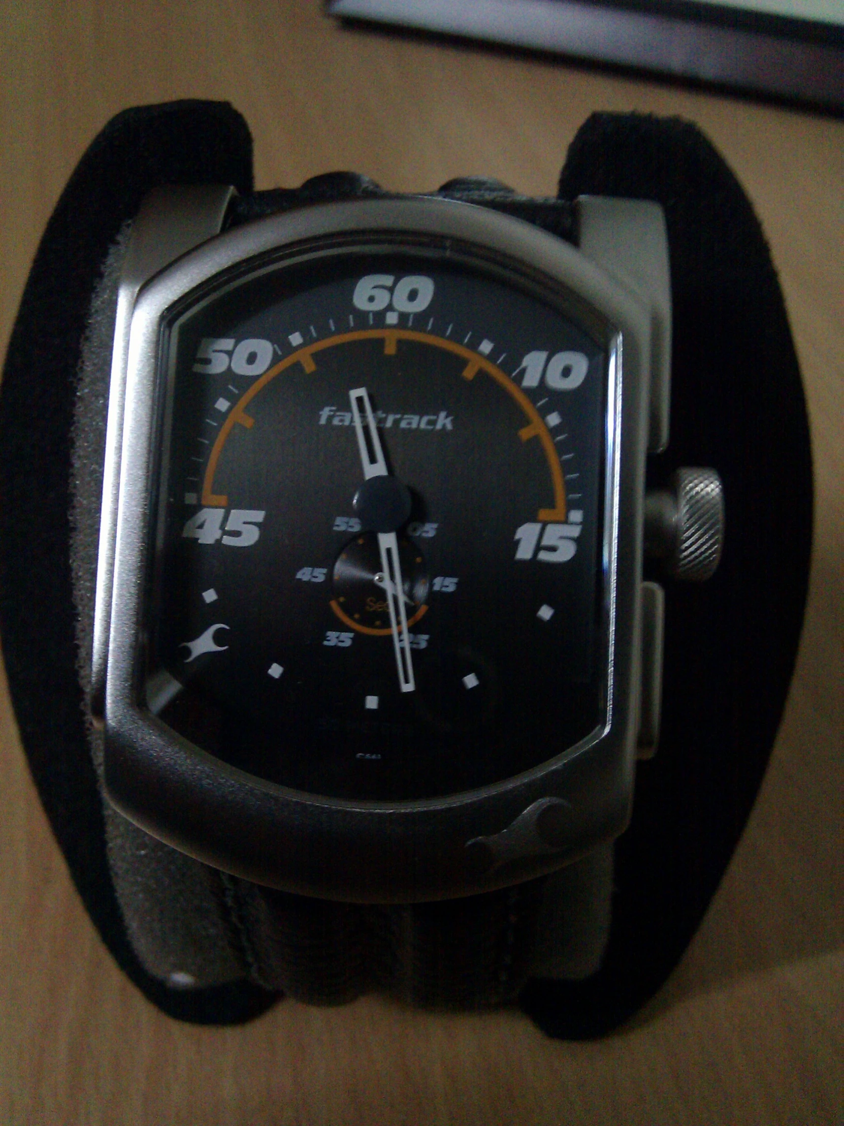 a watch that is placed on a black celet