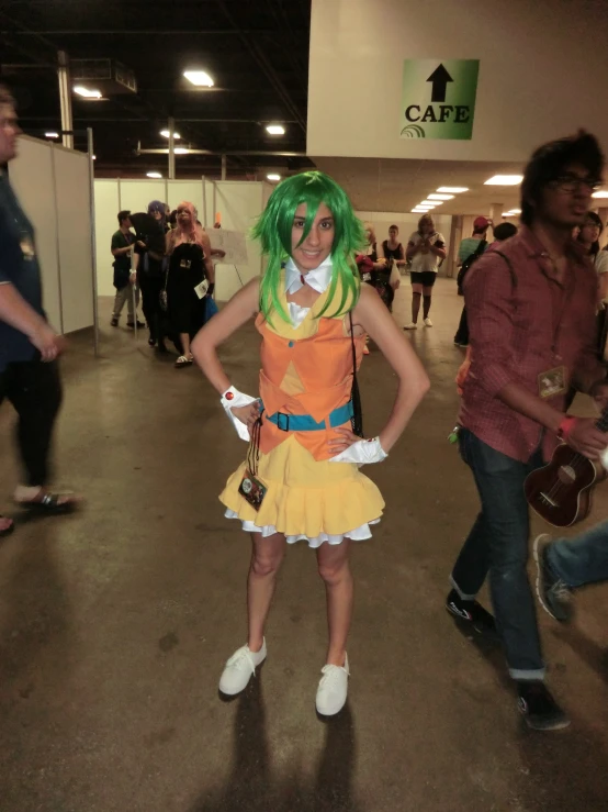 a girl with green hair is posing for a po