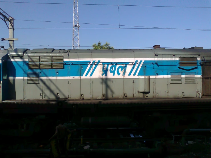 the rear of a train, which is painted blue and white