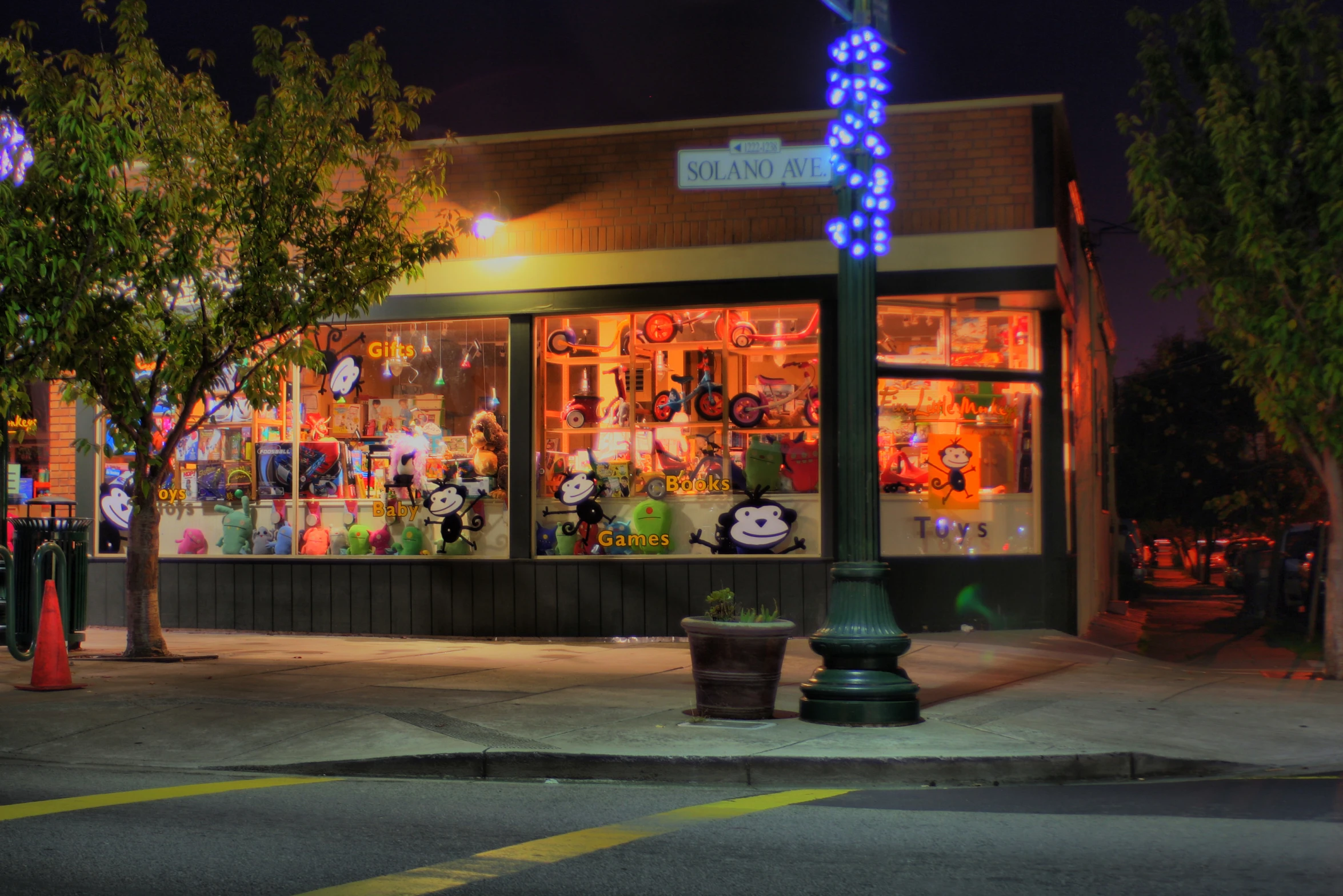 a storefront with illuminated lights displays holiday decorations