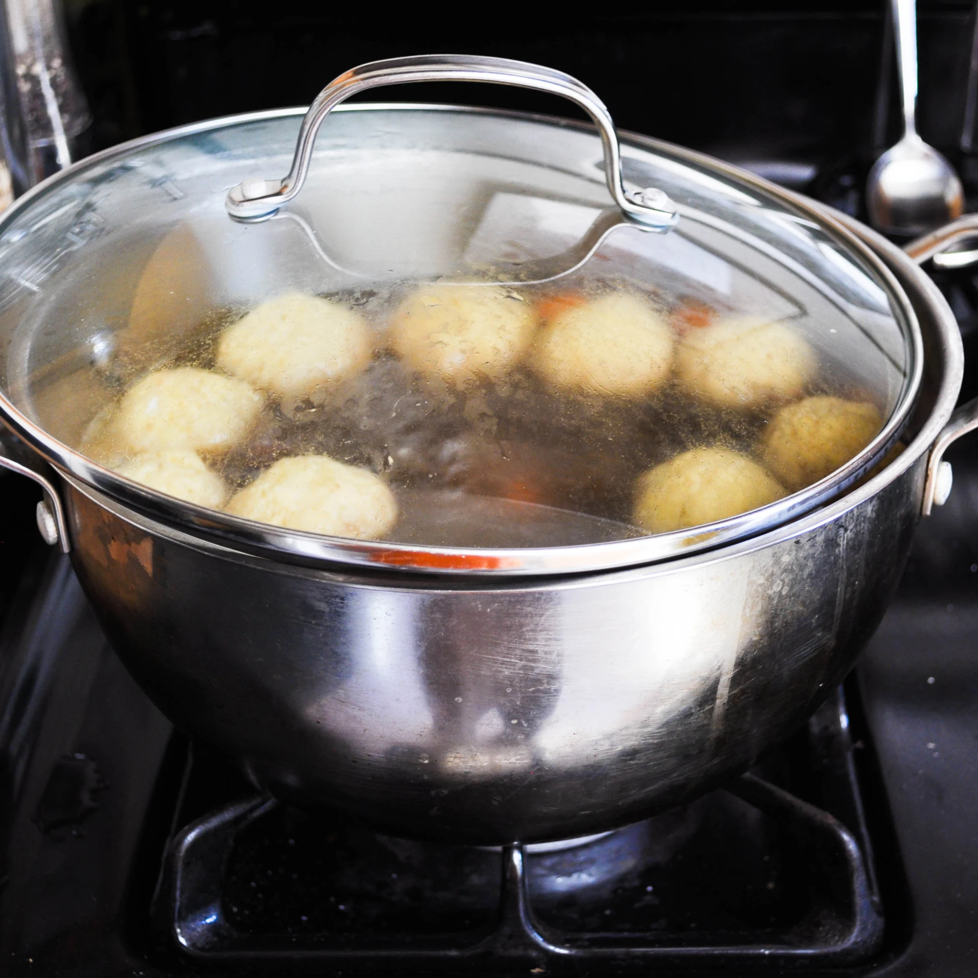 food being cooked in boiling water on a stove