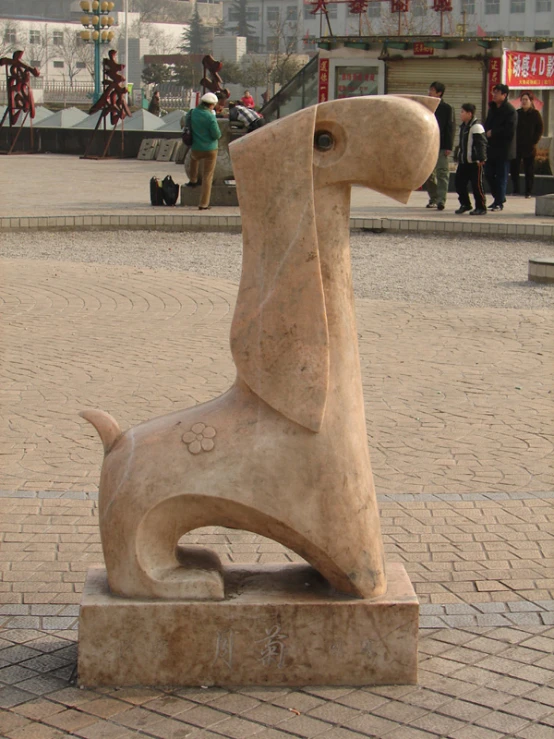 a statue of a dog in a public area