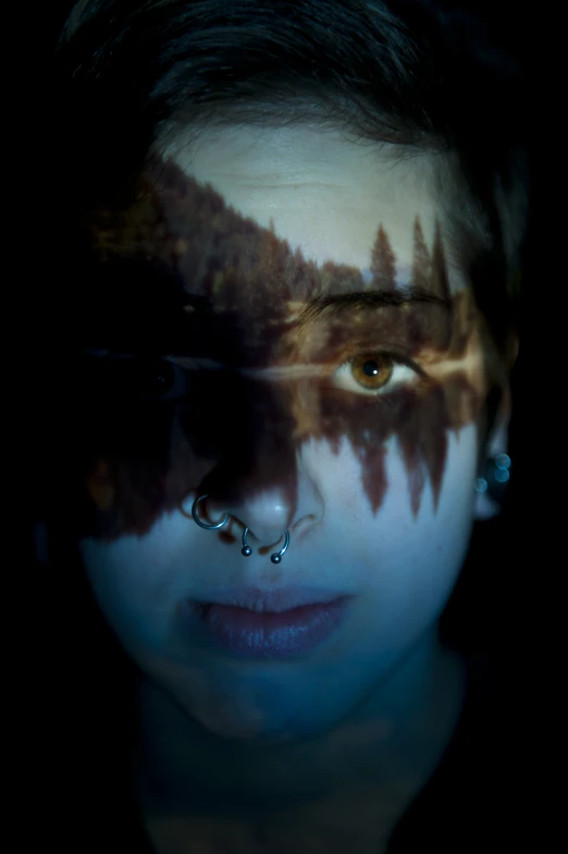 a young woman is wearing white and blue makeup