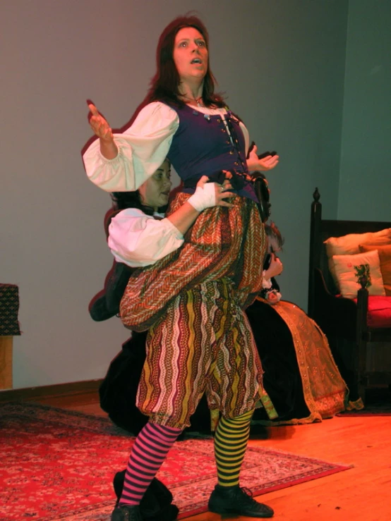 a woman dressed as a pirate riding on a toy horse