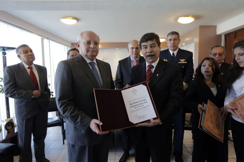 an officer is presenting a certificate for being awarded