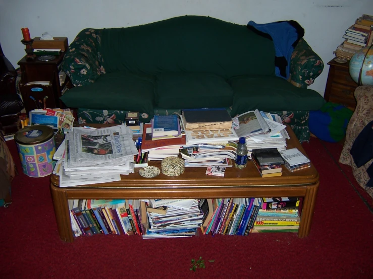 the coffee table has all sorts of books on it