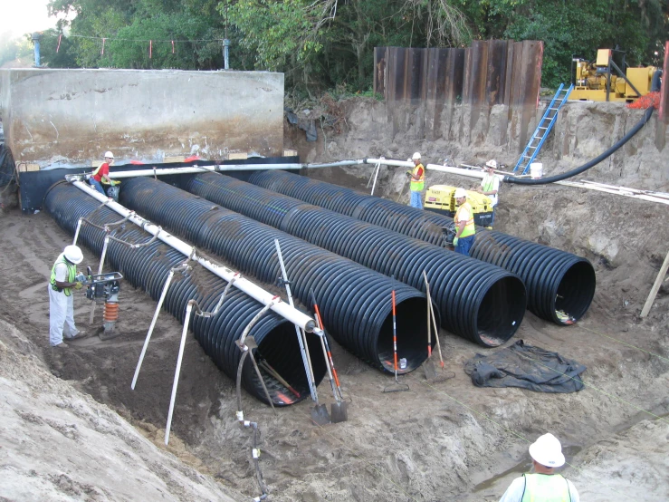 a construction site of pipe lines and a concrete bucket
