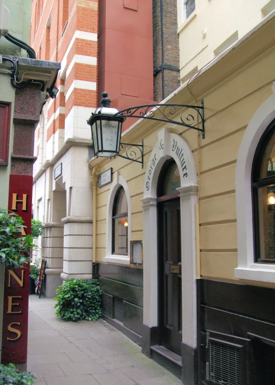 an alley between two historic buildings with lots of arched windows