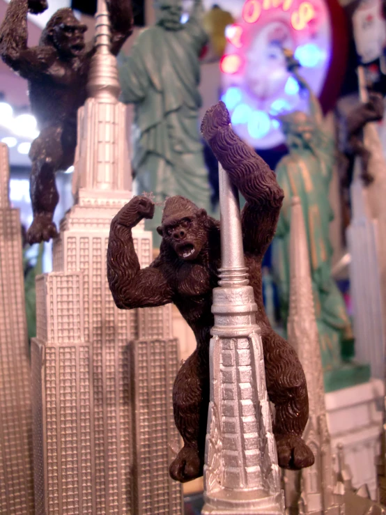 an image of a statue of a gorilla near other buildings