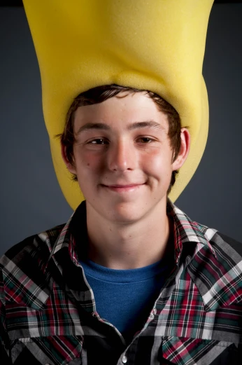 a person wearing a yellow spongebob hat on their head