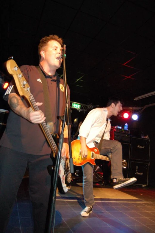 a man that is standing next to a microphone