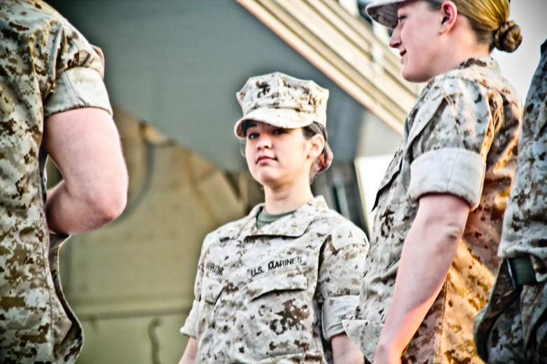 two female soldiers talking to one another